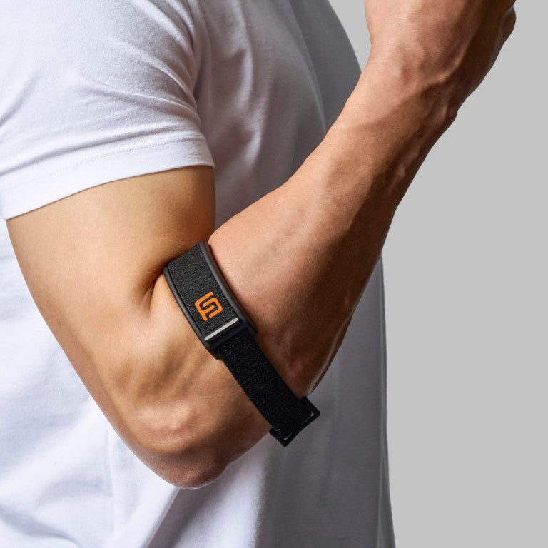 FICOR Active Elbow Stabilizer worn on arm – tennis elbow strap providing targeted compression for tendonitis, forearm pain, and golfers elbow during workout or lifting